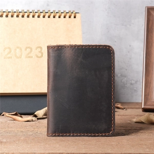 Detail of vintage brown crazy horse leather card holder with premium hand stitching