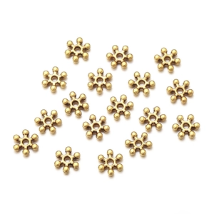 Golden snowflake metal spacer beads for DIY jewelry making and bracelet assembly