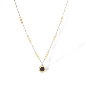Detail of gold-plated geometric necklace with Roman numerals and black circular pendant
