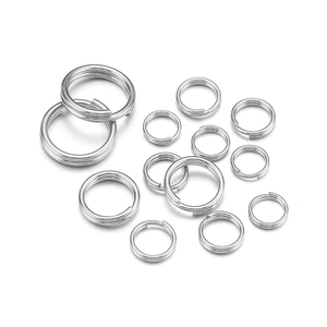 Detailed view of silver stainless steel jump rings in various sizes for jewelry making