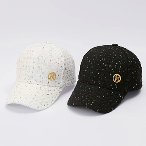 Stylish tweed baseball caps in black and white with sequins and gold letter R logo