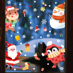 Detail of Santa Claus and reindeer static window stickers on a glass surface