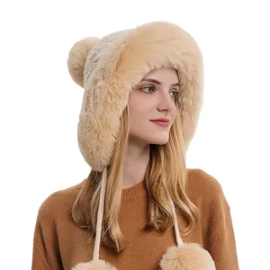 Beige faux fur winter earflap hat with long ties and plush pom poms for women