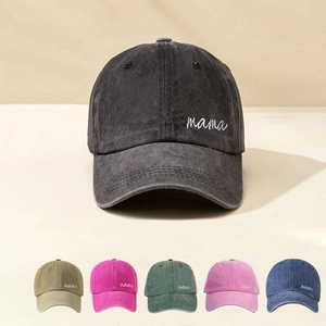 Close-up of embroidered MAMA script on washed cotton baseball caps in multiple colors