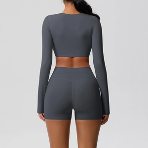 Back view of high-waist charcoal yoga shorts and slim fit long sleeve sports top