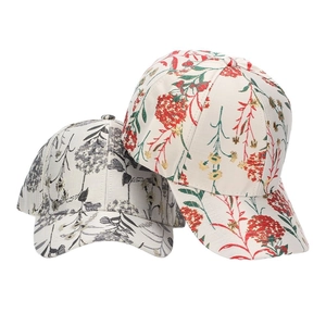 Ethnic floral print baseball cap with gold glitter accents and curved brim for women