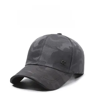 Detailed view of Classic 3D embroidery on dark grey camo baseball cap breathable fabric