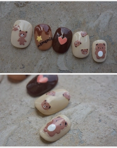 Detail of 5D stereoscopic teddy bear nail art stickers with brown and cream 3D heart motifs
