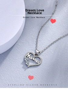 Macro detail of sterling silver Mama heart pendant with pave cubic zirconia crystals