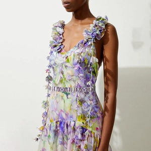Chic purple floral one-piece swimsuit with 3D petal appliques and lace-up neck details