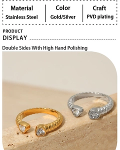 Detail of PVD gold and silver stainless steel rings with heart-shaped zircon stones