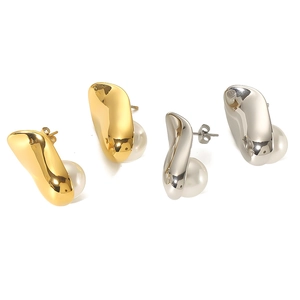 Minimalist gold and silver irregular metal earrings with pearls on a clean white background