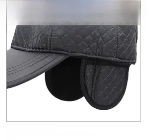 Close-up of diamond quilted windproof fabric and earflaps on warm winter cap
