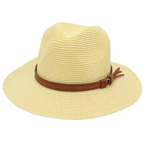 Detail of woven texture and brown faux leather band on beige Panama fedora hat