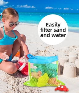Mesh beach bag detail showing yellow net filtering sand and water with colorful toys inside