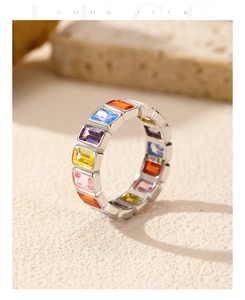 Macro shot of silver eternity ring featuring rainbow rectangular-cut zircon stones