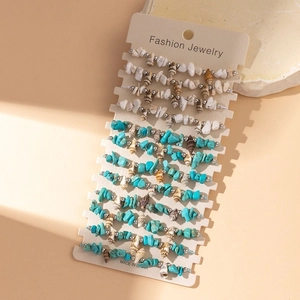 Detail of bohemian summer beach bracelet set with turquoise stones and natural shells