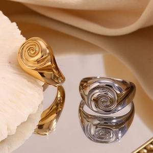 Detailed close-up of 18K gold plated ring featuring embossed spiral swirl pattern
