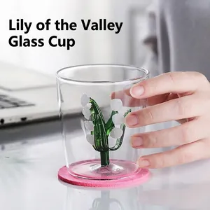 Handheld clear lily of the valley glass cup with 3D flower inside and pink coaster