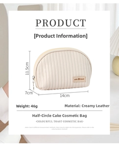 Detail view of cream PU leather half-round makeup bag with size info 14x7x11.5cm