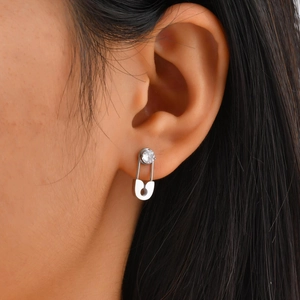 Silver paperclip stud earring with zircon stone on model ear for women