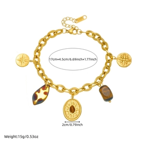 Gold-plated stainless steel Cuban link bracelet with oval starburst compass charms