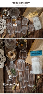 Close-up of vintage PET stickers showing white hand-drawn bottles on a dark wood background
