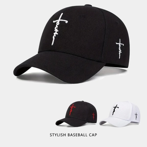 Detail showing cross faith embroidery on multiple baseball caps with cotton texture