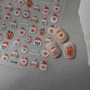 Detailed 5D embossed Christmas nail art stickers featuring Santa and snowman patterns