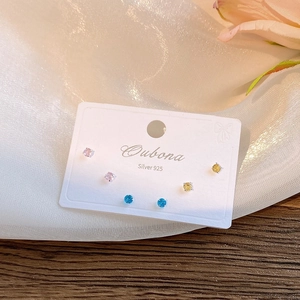 Close-up of S925 silver stud earring set with pink, yellow and blue zircon stones