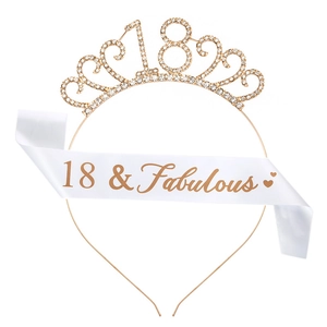 Detail of 18th birthday gold rhinestone crown and white 18 & Fabulous satin sash set