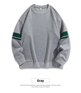 Detail of grey crewneck sweatshirt with green and black striped sleeve ribbons