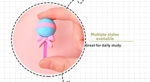 Detail shot of a cute lollipop-shaped eraser with a blue ball and pink bow for students