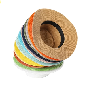 Detail of multi-colored wide brim straw hats with sweatband for summer sun protection