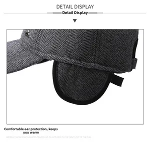 Detail of herringbone wool texture and ear flap design on men's winter warm baseball cap