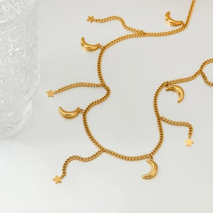 Golden stainless steel waist chain featuring elegant moon and star tassel charms
