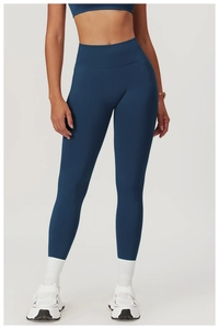 Deep blue high-waisted seamless yoga leggings and top set shown in a sporty outfit