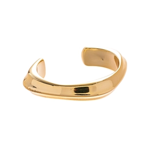Minimalist gold-plated irregular wavy bangle with polished metallic organic shape