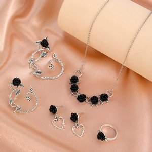 Gothic silver necklace earring and ring set featuring black roses and thorn vines