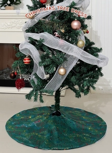 Detailed view of green Christmas tree skirt with colorful star patterns in home setting