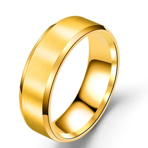 Detailed view of gold men's stainless steel ring with brushed matte finish and beveled edges