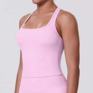 Close-up of pink high-stretch racerback yoga tank top showing square neck and slim fit