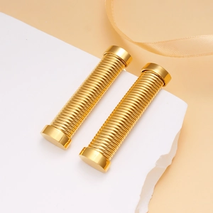 Fashionable 18K gold stainless steel earrings with spiral texture on a stone surface