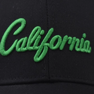 Black cotton baseball cap with green California embroidery detail and twill texture