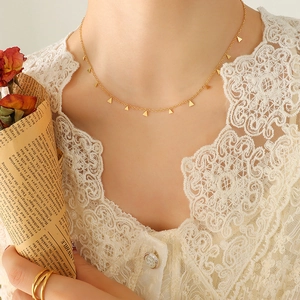 18K gold plated choker necklace with delicate triangle pendants worn on neck