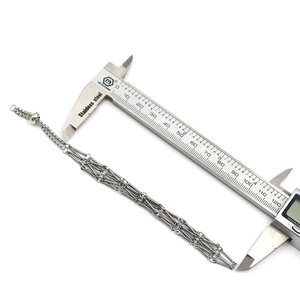 Macro view measuring the 120mm length of the silver multi-strand stainless steel chain