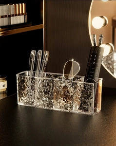 Detail of transparent water ripple acrylic organizer with four compartments for cosmetics