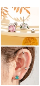 Detail of rose cut snake-shaped stud earrings with pink and green zircon on screw back