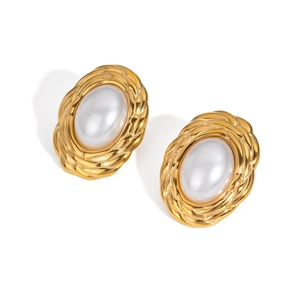 Macro shot of French style gold oval stud earrings with elegant central pearl inlay