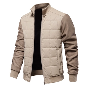 Detail of men's beige jacket featuring quilted body and textured knit sleeve contrast